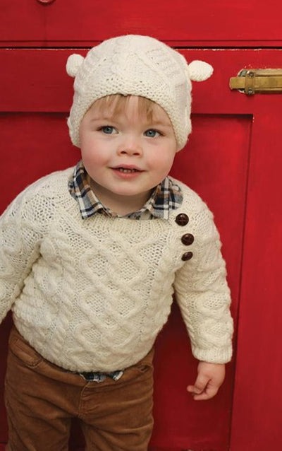 Kids handknit aran hat , colour natural.100% merino wool 