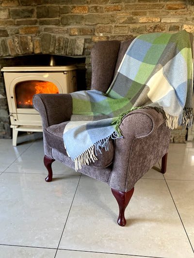 Lambswool throw with wool fringing  on 2 ends measures 137cm x180cm  54'' x 71''baby blue pale olive green cream and grey check box pattern throughout.