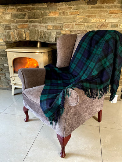 black watch tartan throw. pure wool with fringe on either end . size 137cm x180cm  54'' x 71' forest green navy and black plaid .