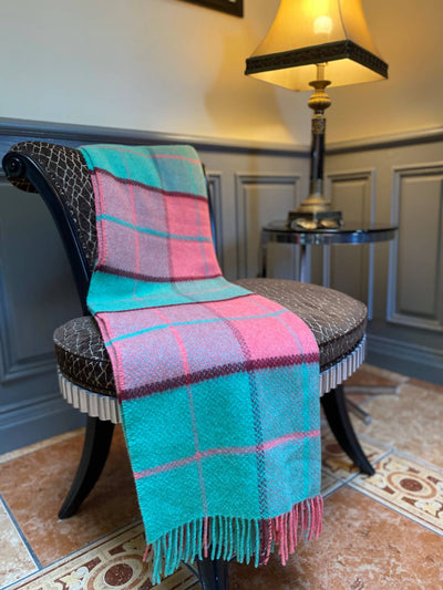 Cashmere and wool blanket . fringing on either end .sea green, coral light and deep mix chequered with burgandy and coral horizontal and vertical lines throughout. 136x180cm
