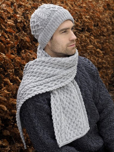 Extra soft scarf . unisex. lattice stitch on centre panel . Cable stitch runs along outer sides and diamond stich runs along the side if the lattice stitch. Soft warm and breathable. Hat to match available. colour light grey .Lattice cable scarf.